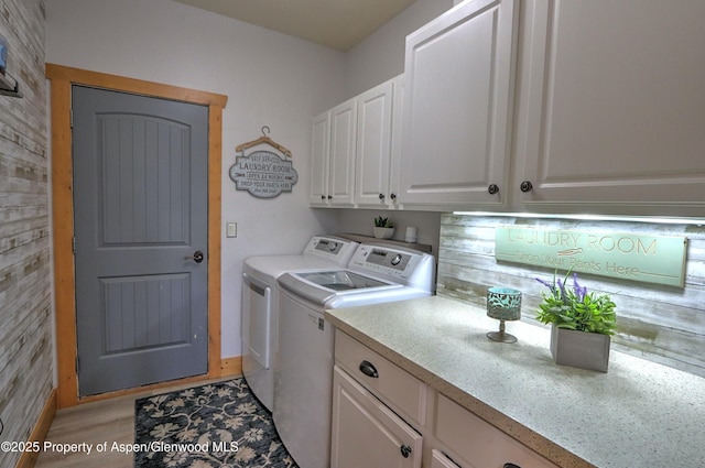 369 N Meadow Dr, Rifle, CO 81650 - laundry room with washing machine and clothes dryer, cabinet space, and light wood-style floors