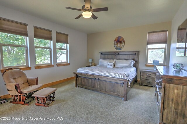 369 N Meadow Dr, Rifle, CO 81650 - bedroom featuring multiple windows, carpet flooring, and a ceiling fan