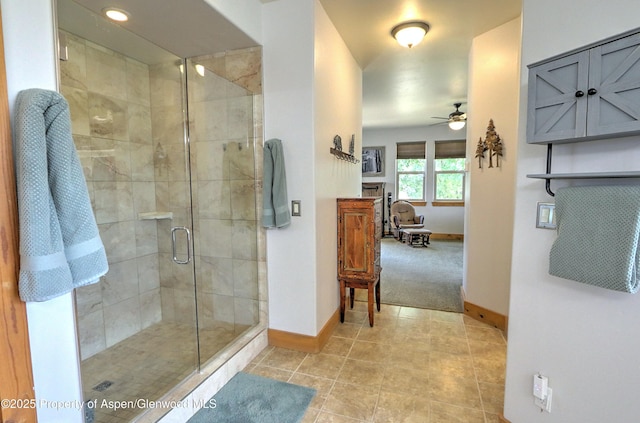 369 N Meadow Dr, Rifle, CO 81650 - full bathroom featuring a ceiling fan, a stall shower, and tile patterned floors