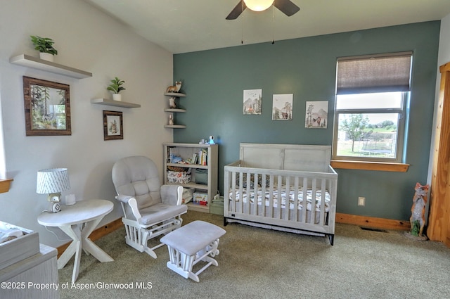 369 N Meadow Dr, Rifle, CO 81650 - carpeted bedroom with a crib and a ceiling fan