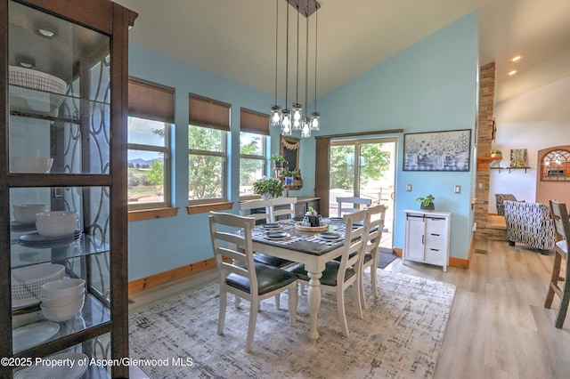 369 N Meadow Dr, Rifle, CO 81650 - dining space with wood finished floors, a chandelier, and high vaulted ceiling