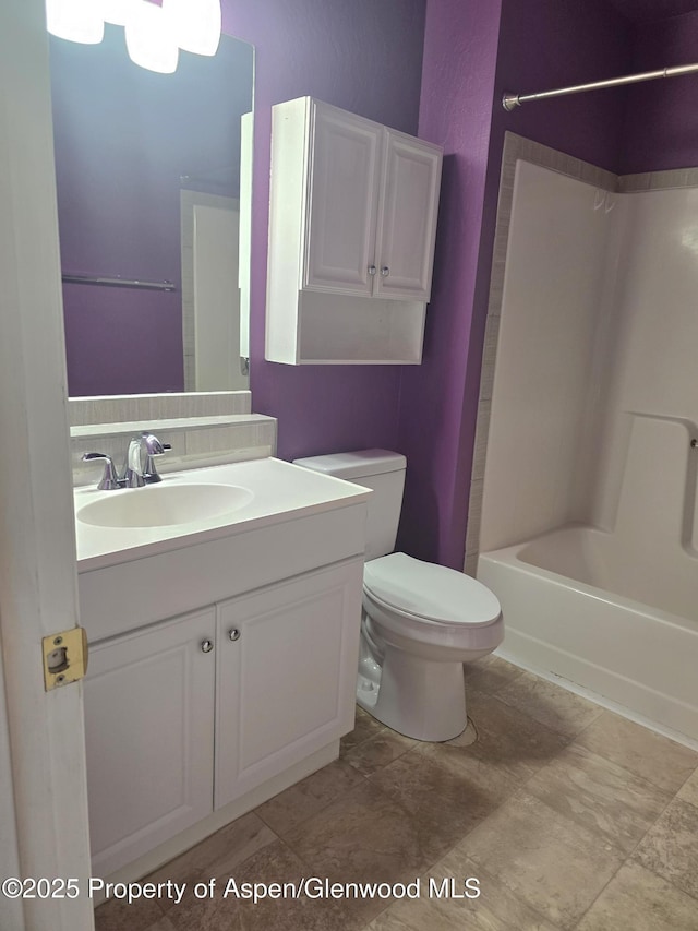 180 E 26th St, Rifle, CO 81650 - bathroom featuring shower / washtub combination, toilet, and vanity