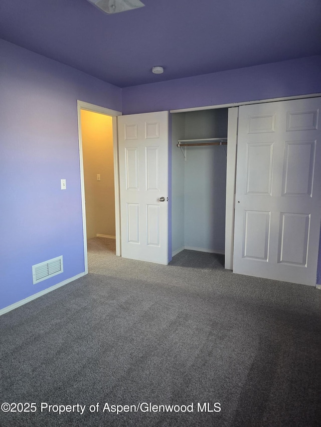180 E 26th St, Rifle, CO 81650 - unfurnished bedroom with carpet floors, a closet, and baseboards