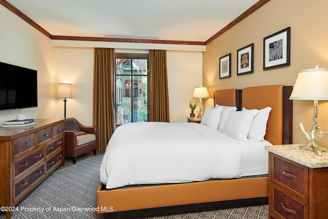 bedroom featuring dark colored carpet and ornamental molding