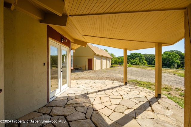 view of patio featuring a garage