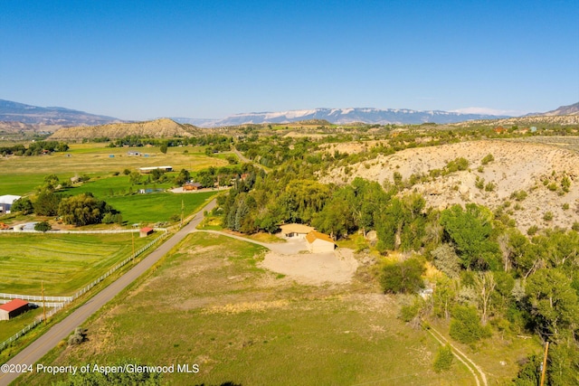 aerial view featuring a rural view and a mountain view