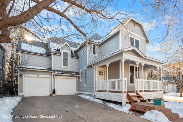 view of front of house with a porch and a garage