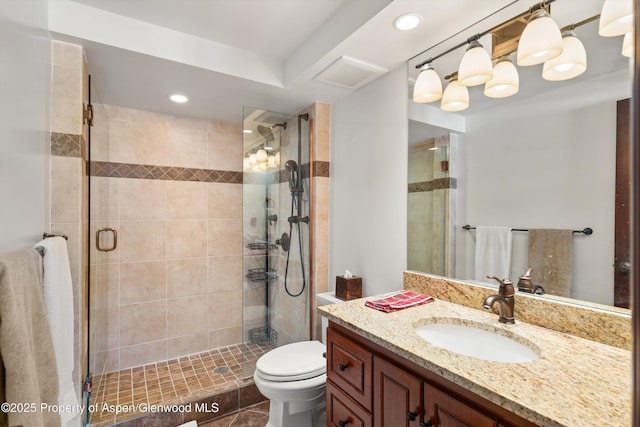 full bathroom with vanity, toilet, recessed lighting, a shower stall, and visible vents