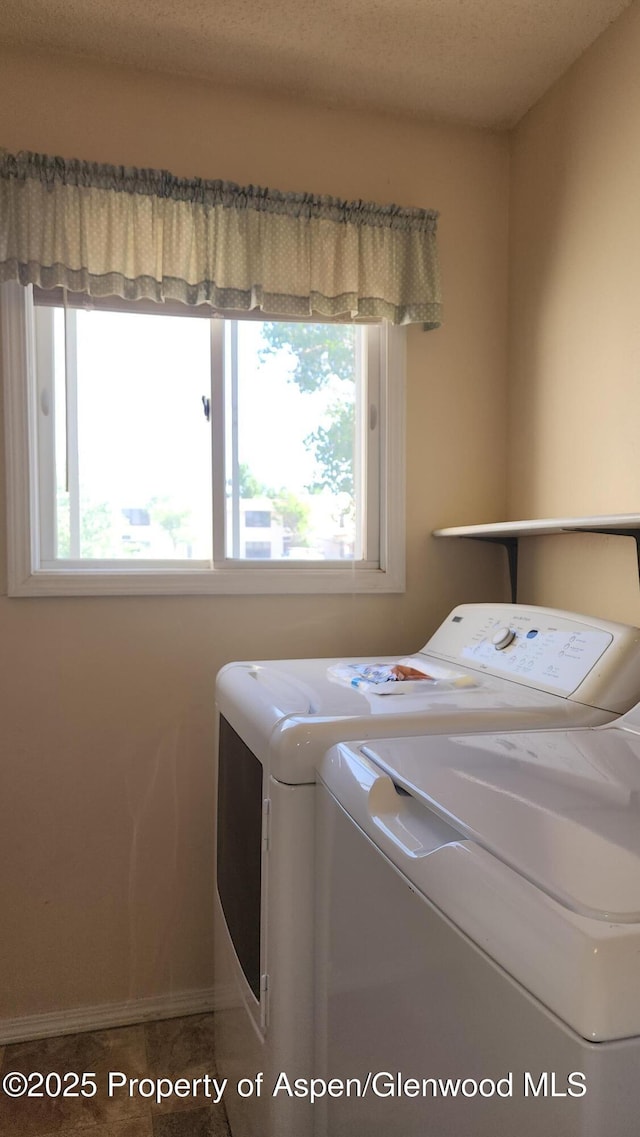 3863 W 6th St, Craig, CO 81625 - washroom with washing machine and clothes dryer and baseboards