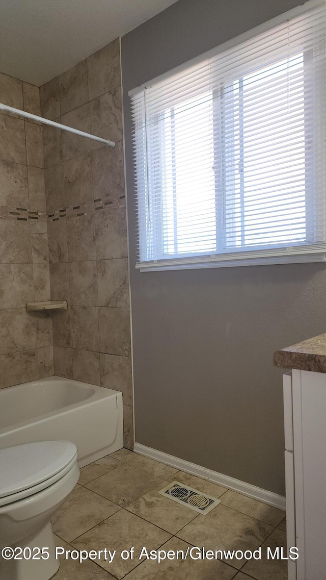 3863 W 6th St, Craig, CO 81625 - bathroom with toilet, vanity, shower / bath combination, tile patterned flooring, and baseboards