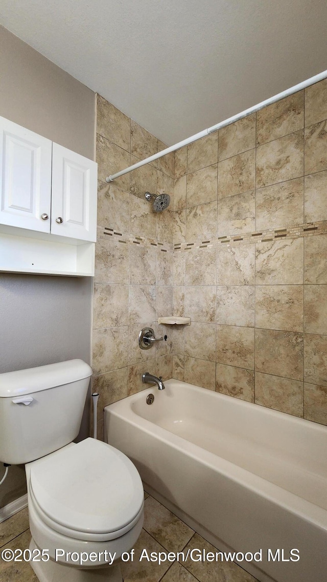 3863 W 6th St, Craig, CO 81625 - bathroom with toilet,  shower combination, and tile patterned flooring