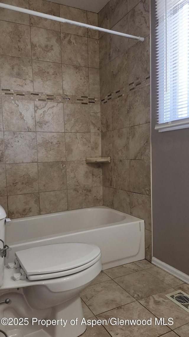 3863 W 6th St, Craig, CO 81625 - full bathroom featuring toilet, shower / bath combination, baseboards, and tile patterned flooring