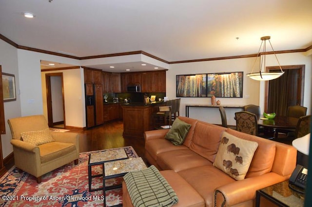 living room with crown molding and dark wood-type flooring