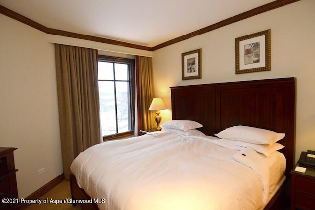 bedroom featuring carpet and crown molding