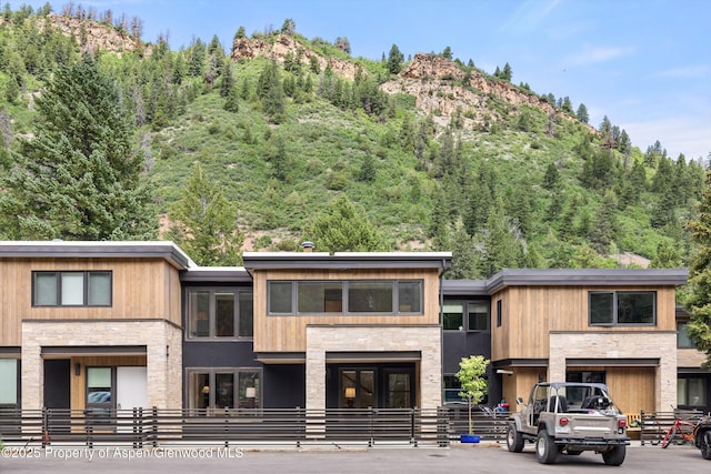 1501 Maroon Creek Rd # 2, Aspen, CO 81611 - view of property featuring a mountain view and a view of trees