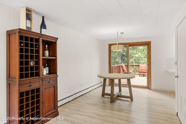 1501 Maroon Creek Rd # 2, Aspen, CO 81611 - dining area featuring baseboard heating and light wood-style flooring