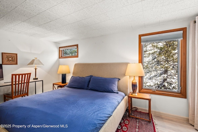 1501 Maroon Creek Rd # 2, Aspen, CO 81611 - bedroom with wood finished floors and baseboards