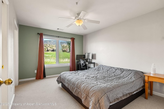 carpeted bedroom featuring ceiling fan, baseboards, and visible vents