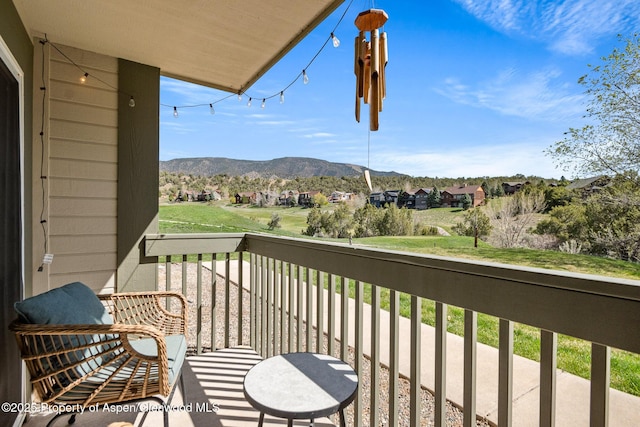 balcony featuring a mountain view and a residential view