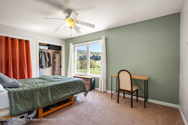 bedroom with carpet floors, baseboards, and ceiling fan
