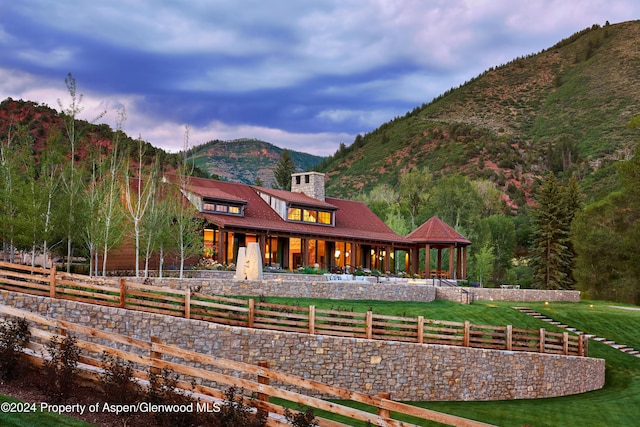 rear view of property with a mountain view