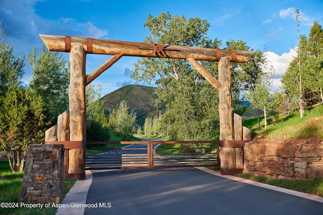 view of gate featuring a mountain view