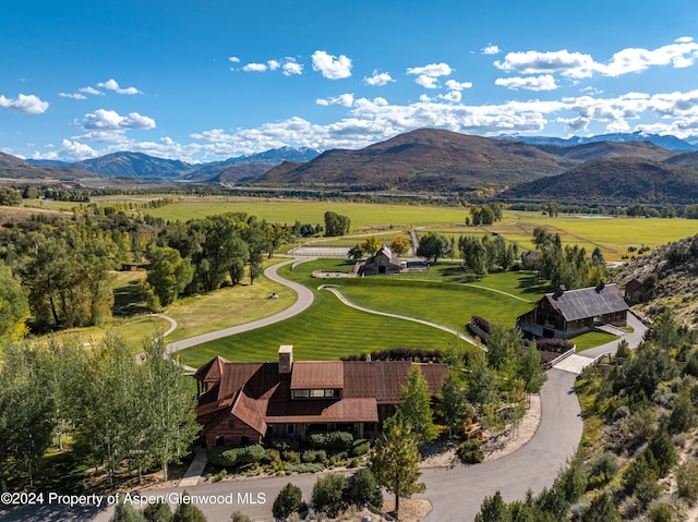 drone / aerial view with a mountain view and a rural view