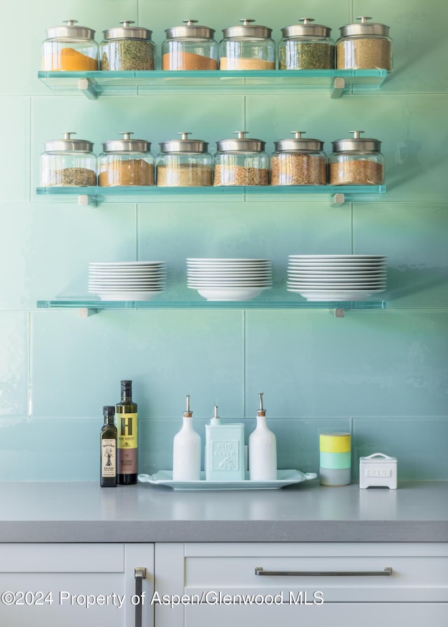 bar featuring white cabinetry