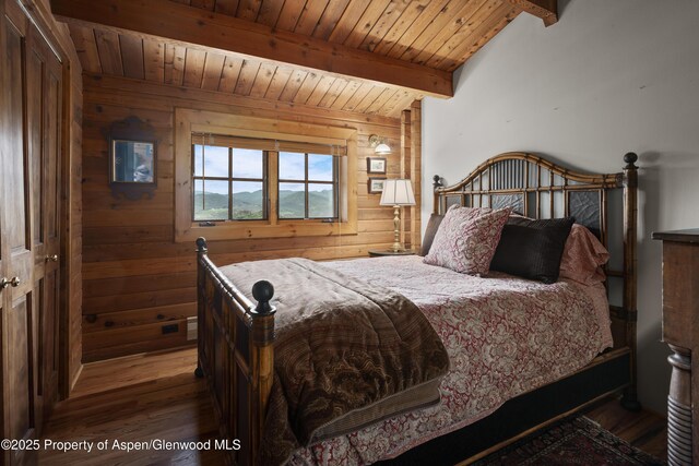 47 Mule Deer Run, Snowmass, CO 81654 - bedroom featuring wood finished floors, a wooden ceiling with exposed beams, and wooden walls