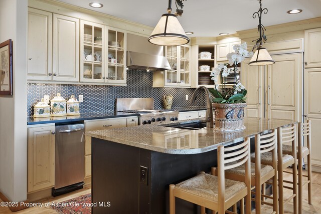 47 Mule Deer Run, Snowmass, CO 81654 - kitchen with stove, wall chimney exhaust hood, backsplash, pendant lighting, and recessed lighting