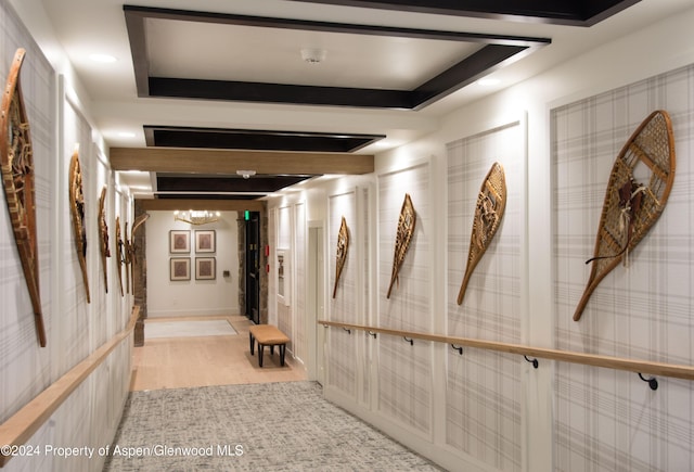300 Carriage Way Unit 614, Snowmass Village, CO 81615 - corridor with light wood-style flooring and a chandelier
