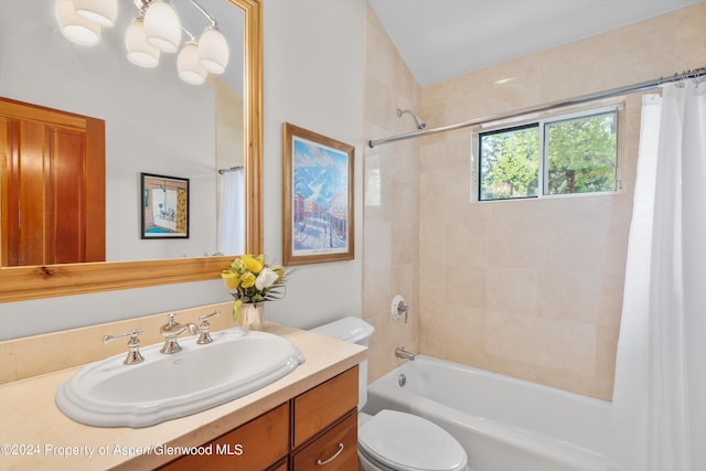full bath with toilet, shower / bathtub combination with curtain, and vanity