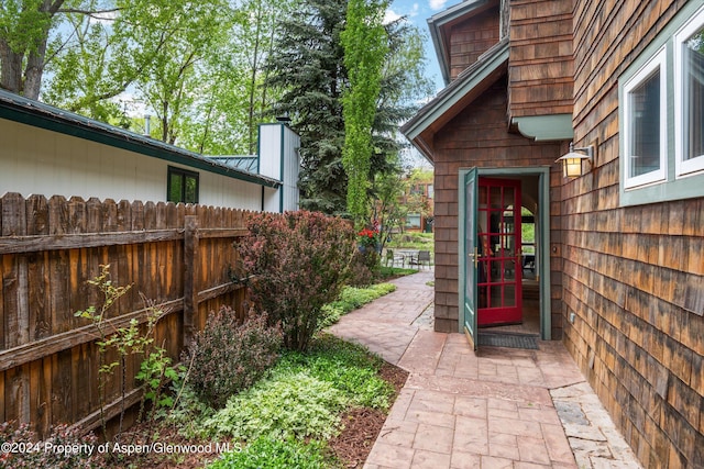 property entrance featuring fence