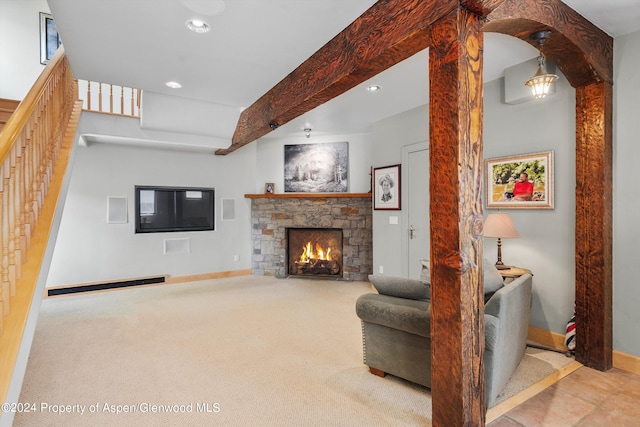carpeted living area featuring a baseboard heating unit, stairs, recessed lighting, baseboards, and a stone fireplace
