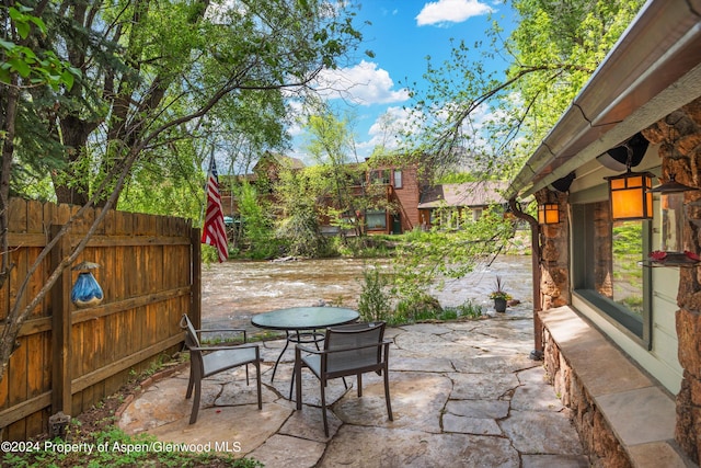 view of patio / terrace featuring fence