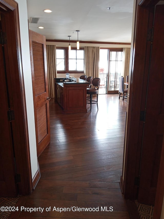 corridor featuring dark hardwood / wood-style floors