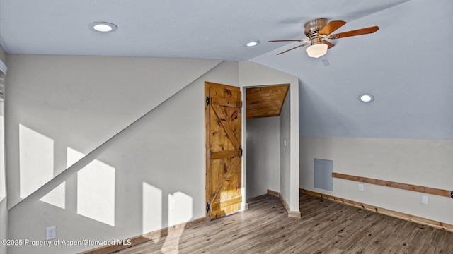 additional living space with recessed lighting, ceiling fan, wood finished floors, and vaulted ceiling