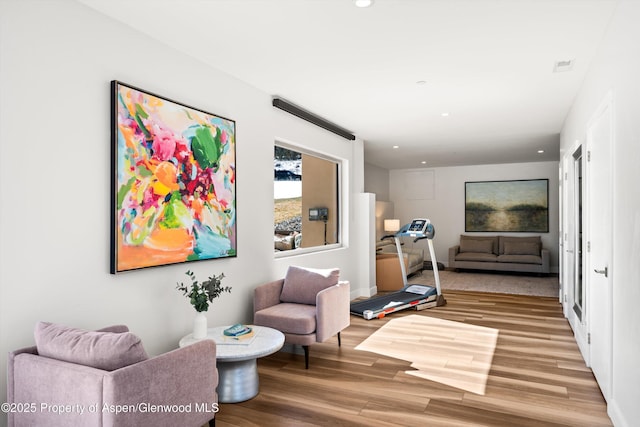 sitting room featuring recessed lighting and wood finished floors