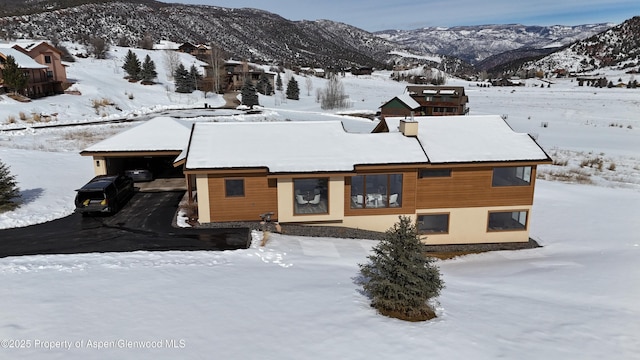 exterior space featuring a carport and a mountain view