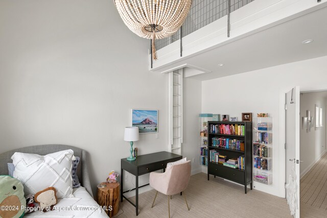 office space with carpet floors and a towering ceiling