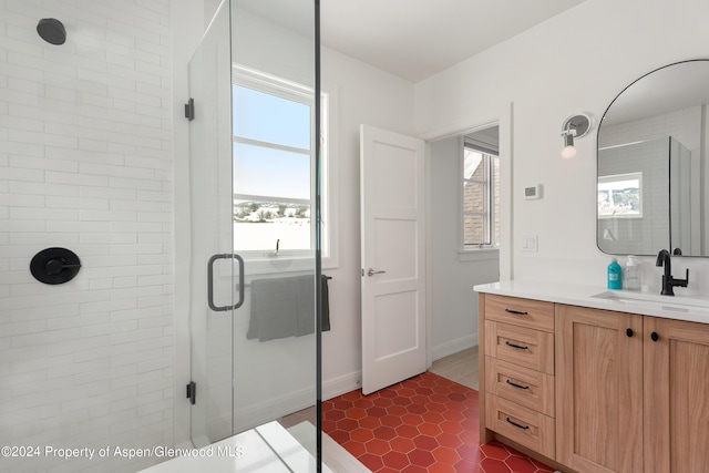 bathroom featuring vanity and an enclosed shower