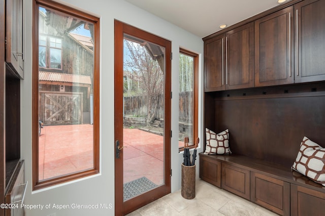 mudroom featuring light tile patterned flooring