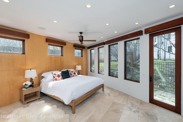 bedroom with recessed lighting and access to outside