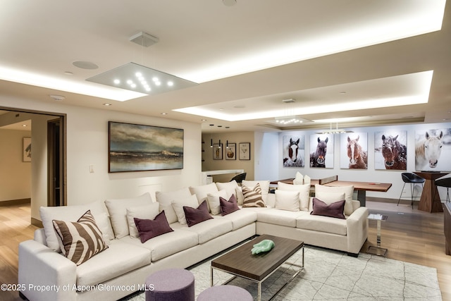 126 Juan St, Aspen, CO 81611 - living area with a tray ceiling and light wood finished floors