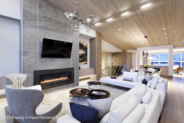 126 Juan St, Aspen, CO 81611 - living room with a fireplace, wood finished floors, wood ceiling, recessed lighting, and vaulted ceiling