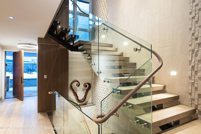 126 Juan St, Aspen, CO 81611 - stairway featuring wood finished floors and a wall of windows