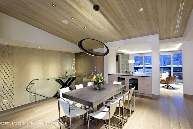 126 Juan St, Aspen, CO 81611 - dining space featuring beverage cooler, light wood finished floors, recessed lighting, and wooden ceiling
