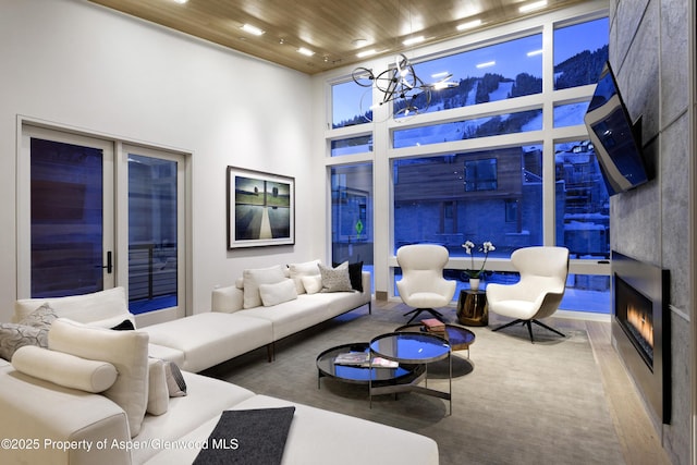 126 Juan St, Aspen, CO 81611 - living area featuring a high ceiling, wooden ceiling, a chandelier, and a fireplace
