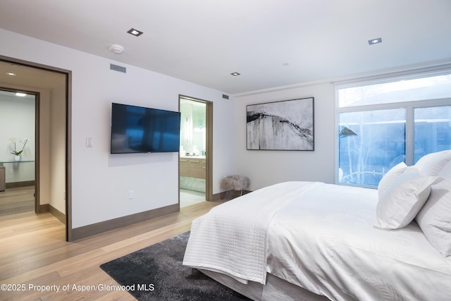 126 Juan St, Aspen, CO 81611 - bedroom featuring light wood finished floors and connected bathroom