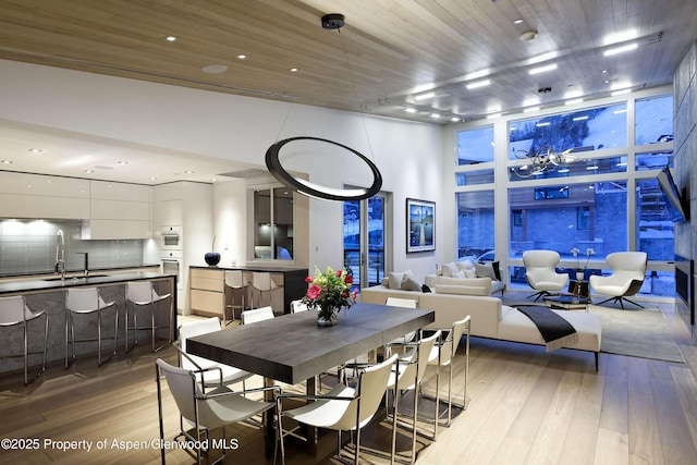 126 Juan St, Aspen, CO 81611 - dining space with light wood-style flooring and recessed lighting